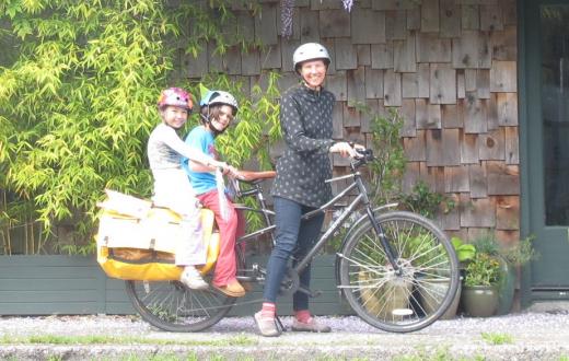 Mom toting kids on bike