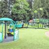 Kids play on the inclusive accessible play equipment at Everett, Washington's Forest Park updated playground best seattle weekend activities kids and families
