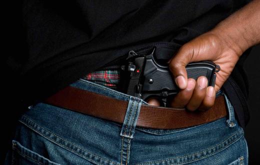 Gun hidden in waistband of jeans