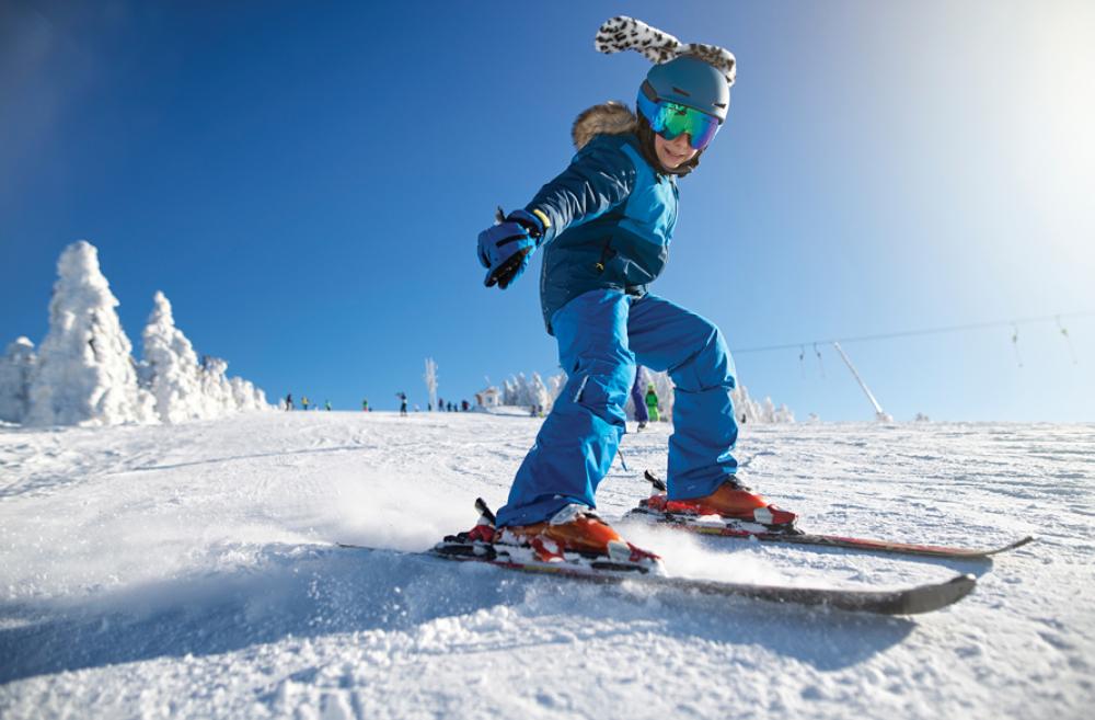 girl skiing on a sunny day