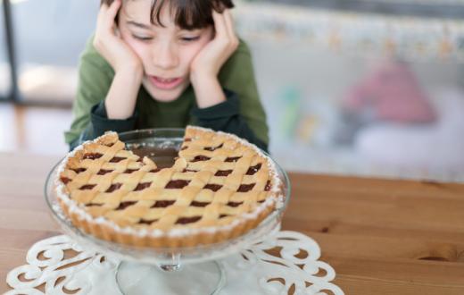 Kid looking at pie