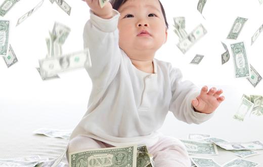 Baby playing with dollars