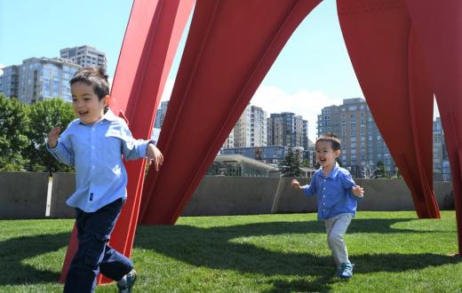 little boys running through the sculpture park by the Seattle waterfront