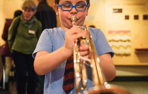 A young musician practices at the Seattle Symphony